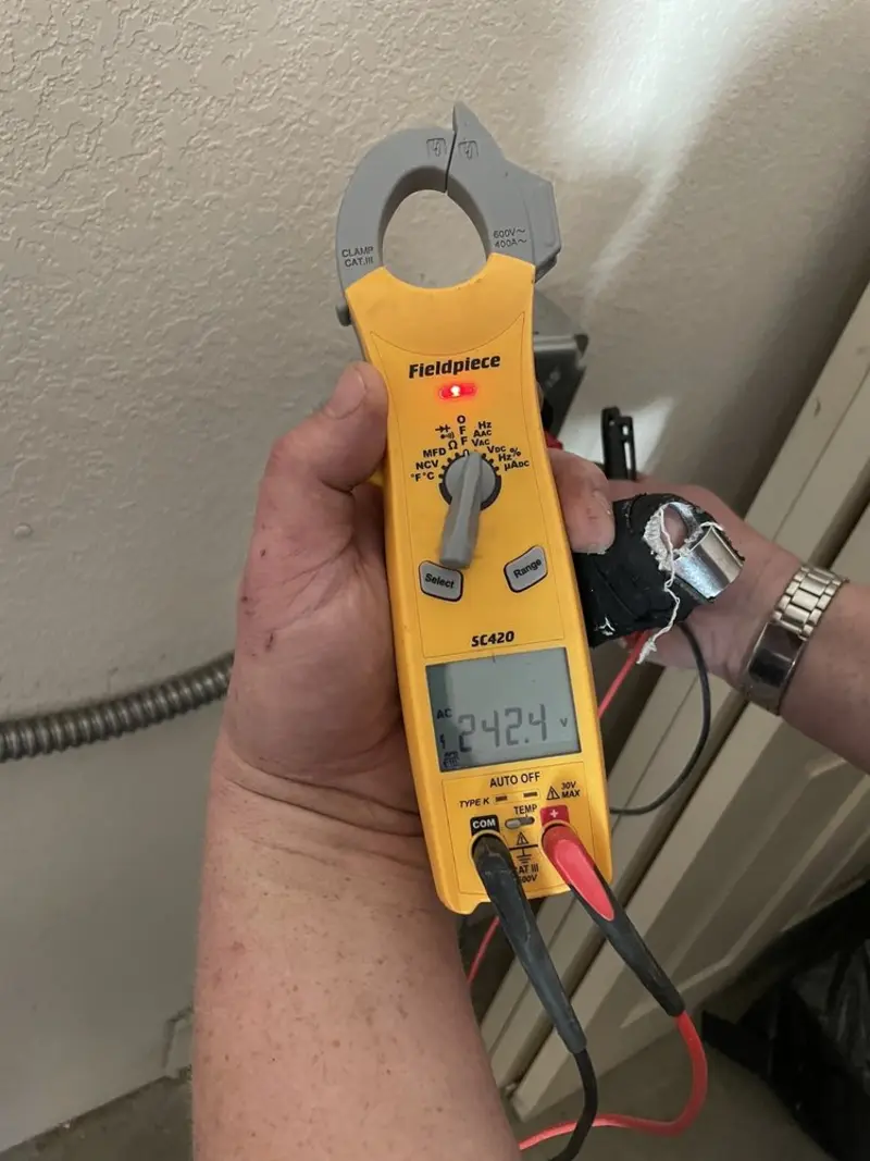 Voltage testing with clamp meter during Electrical Installation Services in New Port Richey